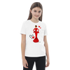 Niña feliz usando la camiseta flamenca de algodón 100% orgánico, modelo María vestido rojo, en un entorno festivo.