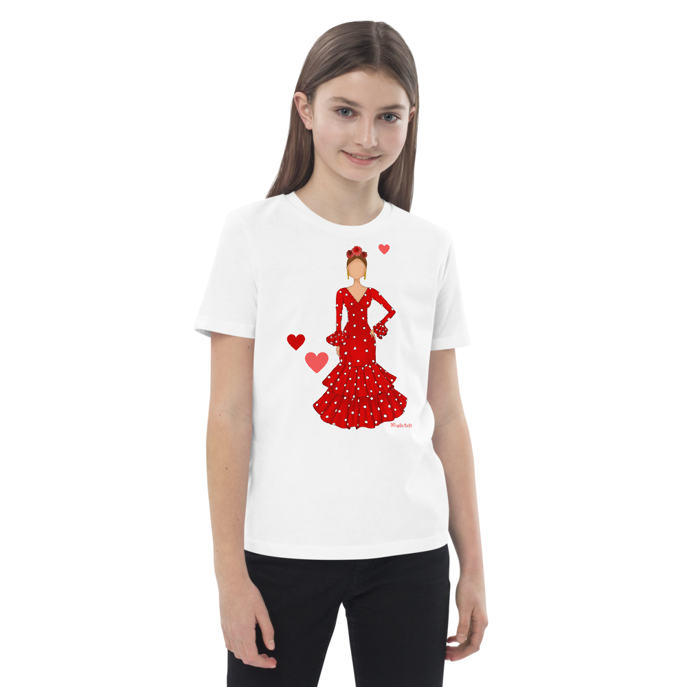 Camiseta flamenca de niñas de algodón 100% orgánico - Modelo Ana, mostrando a una niña con una alegre camiseta blanca con un diseño flamenco en rojo con lunares.