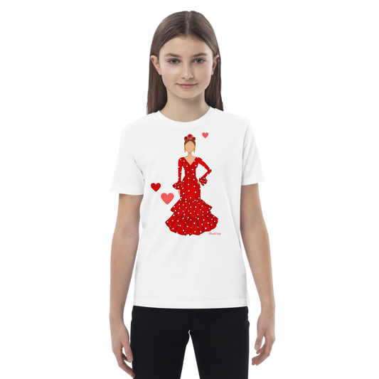 Camiseta flamenca de niñas de algodón 100% orgánico - Modelo Ana, imagen de una niña posando con una camiseta blanca que muestra el diseño flamenco.
