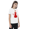 Camiseta flamenca de niñas de algodón 100% orgánico - Modelo Ana, camiseta decorada con un diseño flamenco, junto a un par de zapatos deportivos.