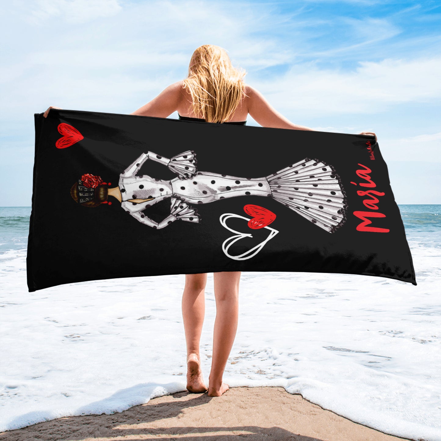 a woman holding a towel with a skeleton on it