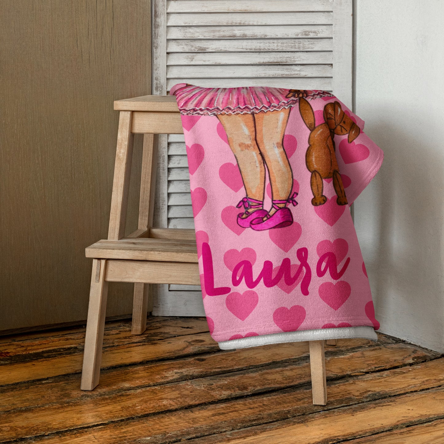 a pink blanket with a picture of a woman's legs and a poodle