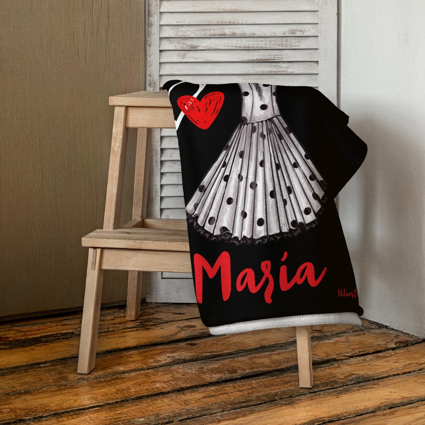 a black and white dress with a red heart on it