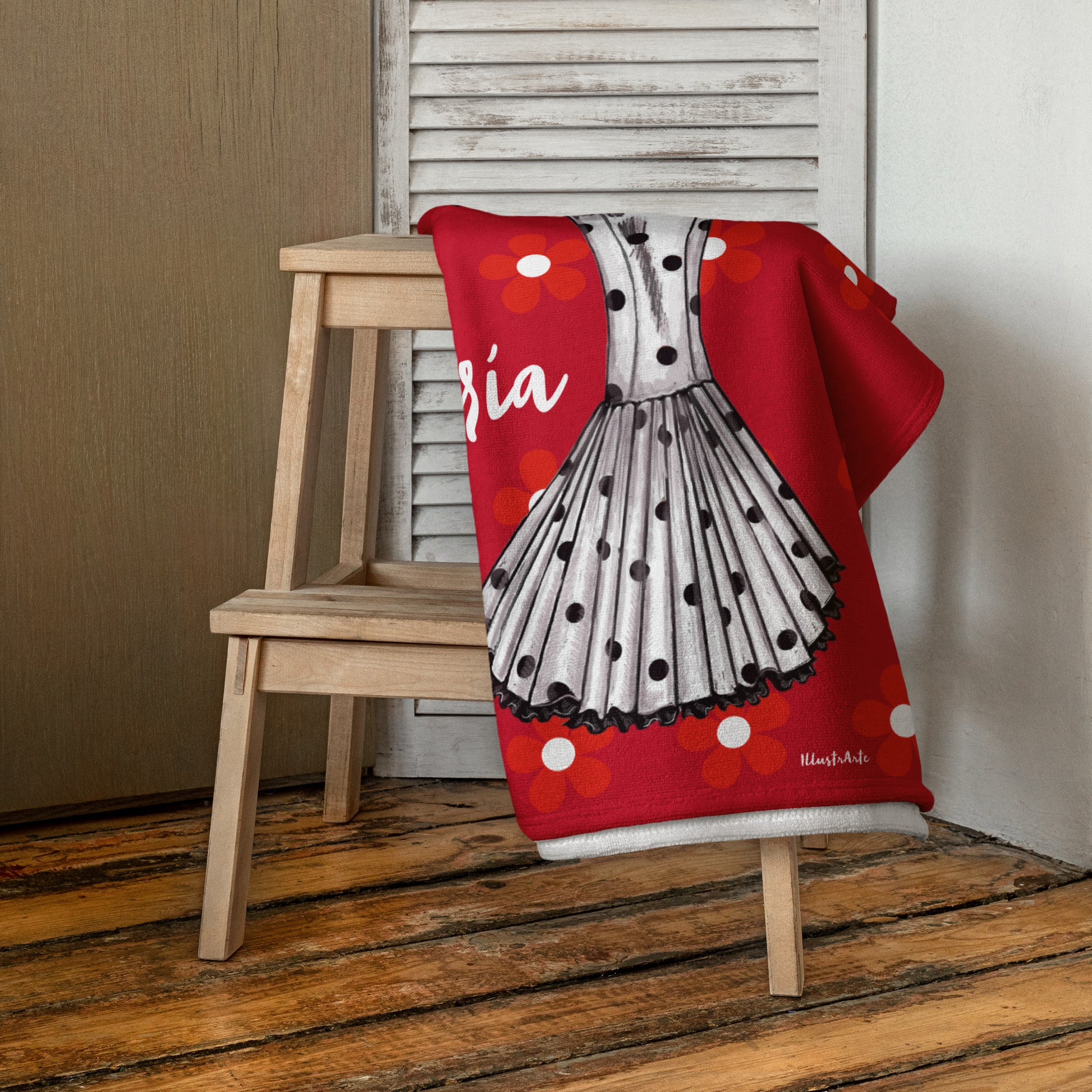 a red blanket with a polka dot dress on it