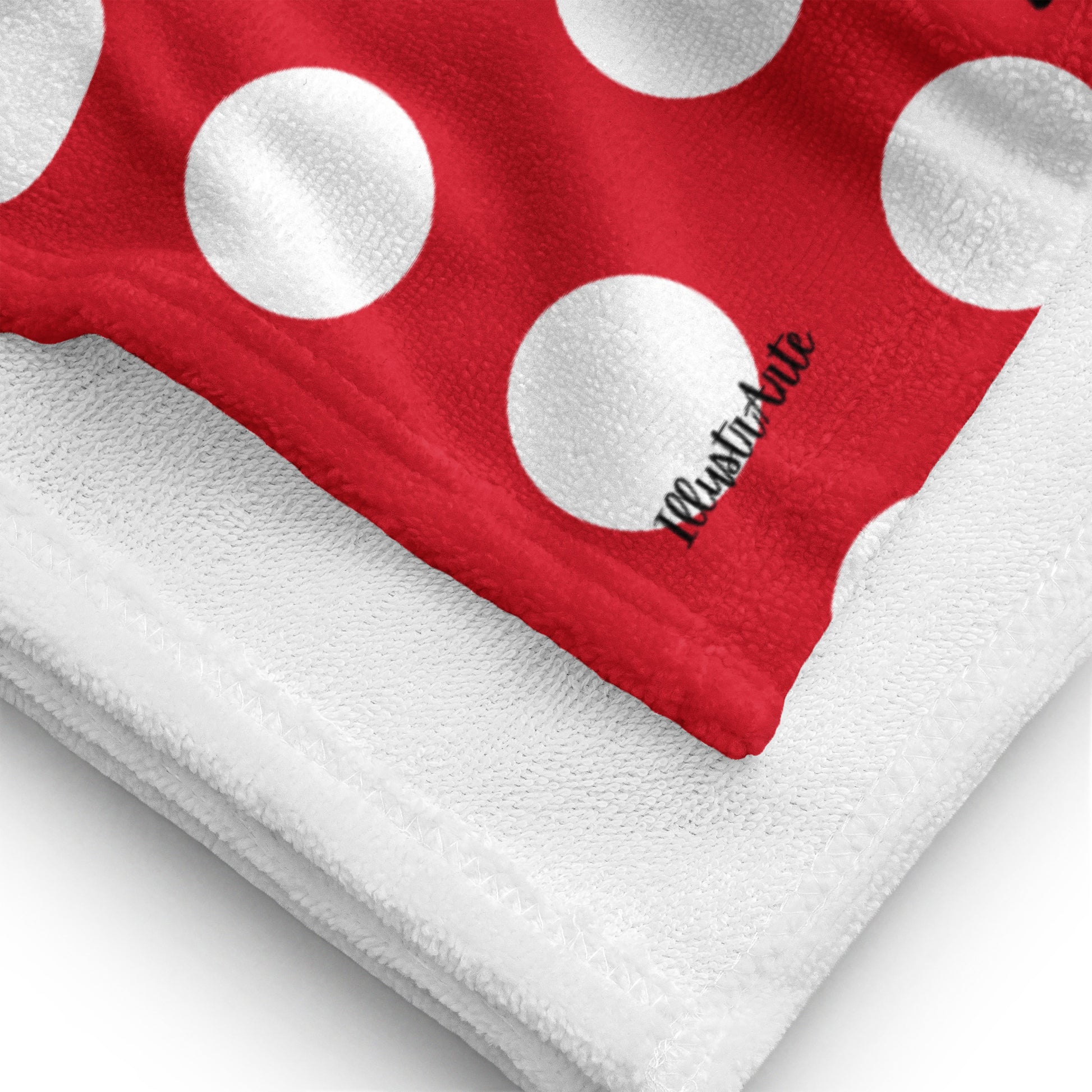 a red and white towel with white polka dots