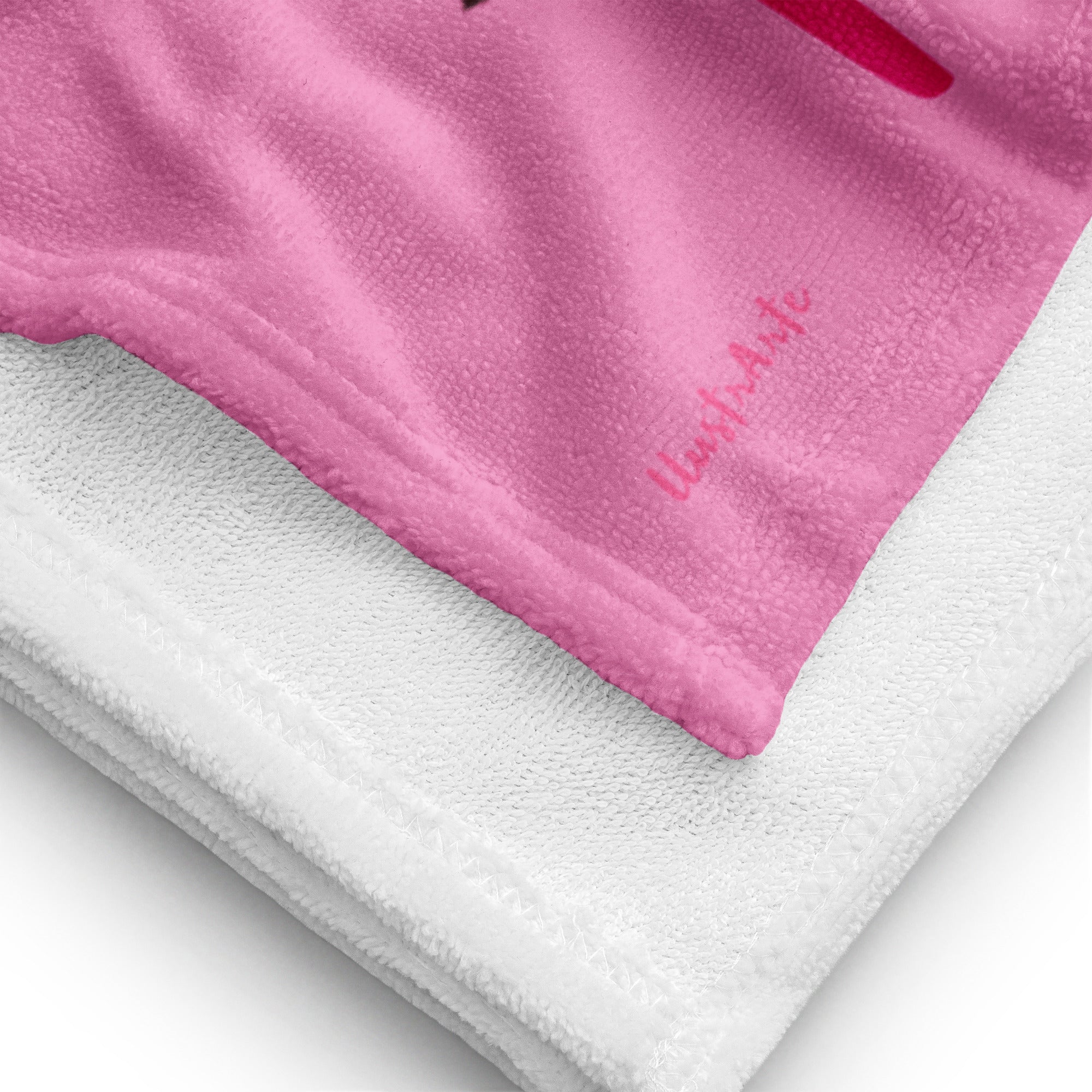 a close up of a pink and white towel